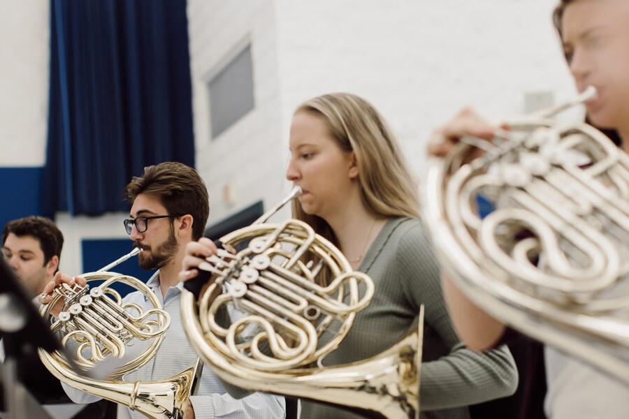 students from the music education program playing the french horn