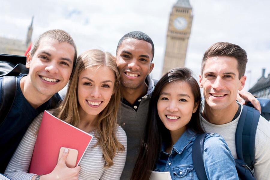 study abroad students standing in a group smiling
