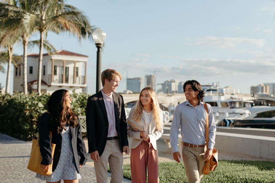 master of business administration mba students walk near the intercoastal waterway in 西<a href='http://psykuj7.online-avm.com'>推荐全球最大网赌正规平台欢迎您</a>.